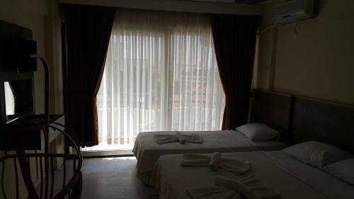 OZGUN APART OTEL KUSADASI фото 7
