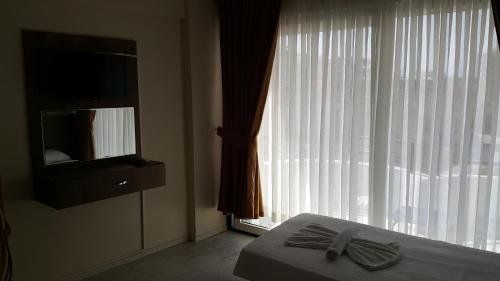OZGUN APART OTEL KUSADASI фото 2